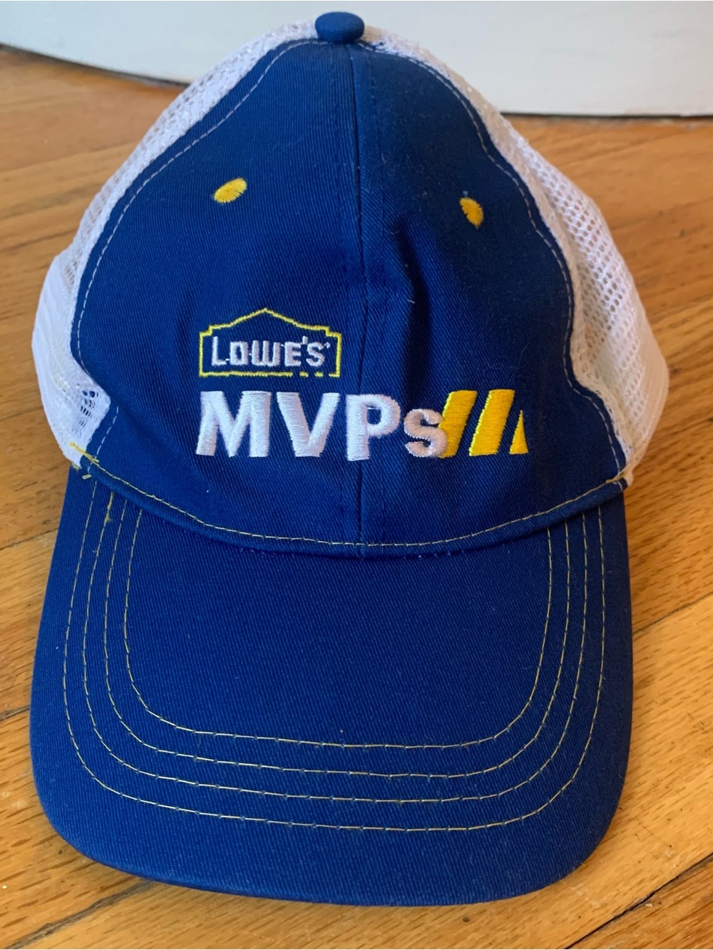 Lowe’s  MVPs blue trucker cap with white mesh back and yellow accents